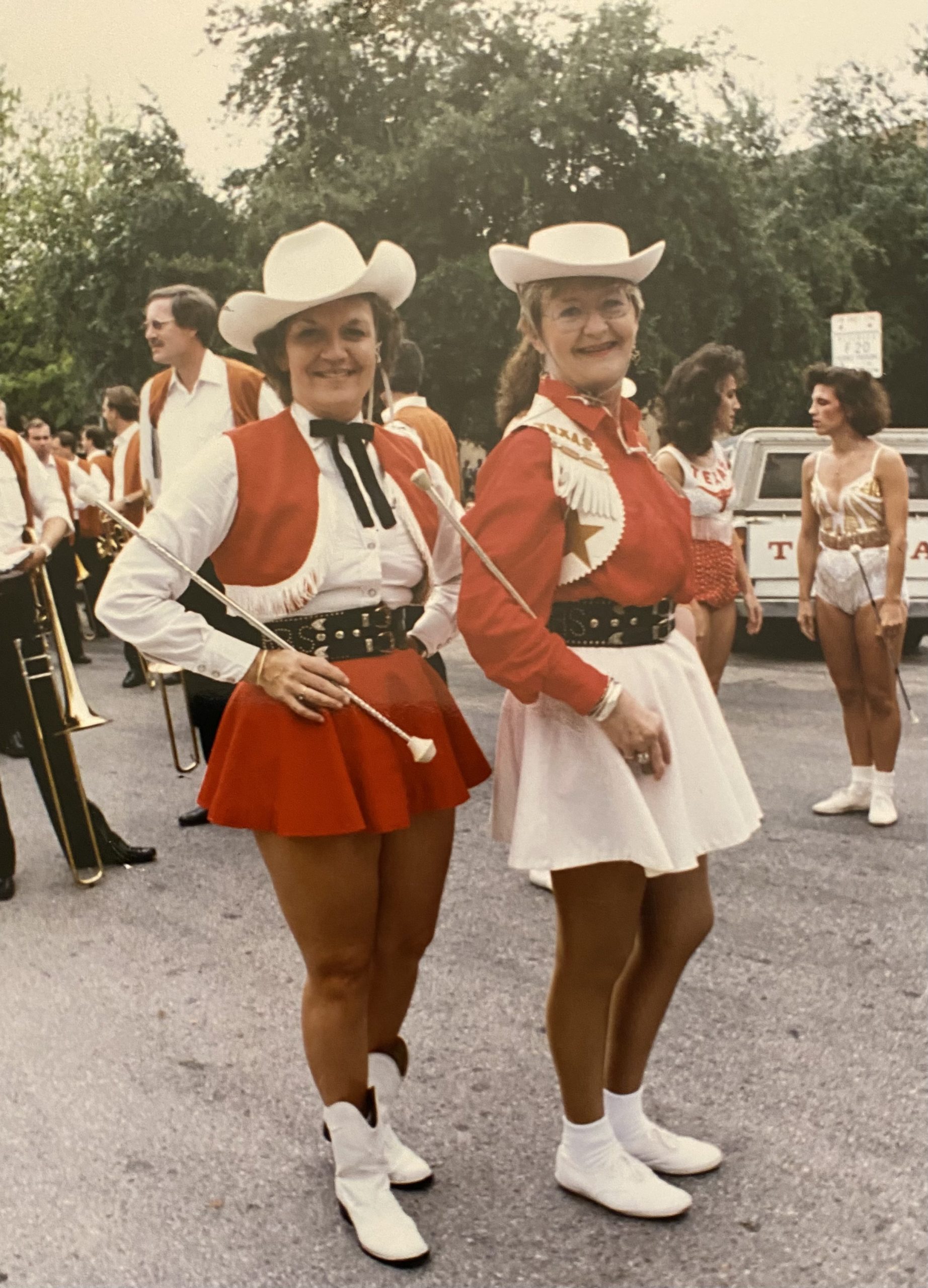 Emma Lea King Mayton and Kay Sharon Wilhite Snitzer twirling with the Longhorn Alumni Band