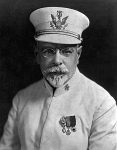 John Philip Sousa in a white bandmaster uniform and white hat